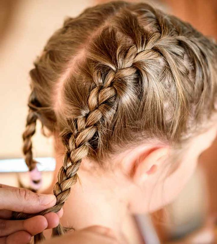 A girl showcasing a pretzel braid hairstyle with elegance