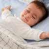 How to Dress Baby for Sleep a baby is sleeping with good dreams shown in image
