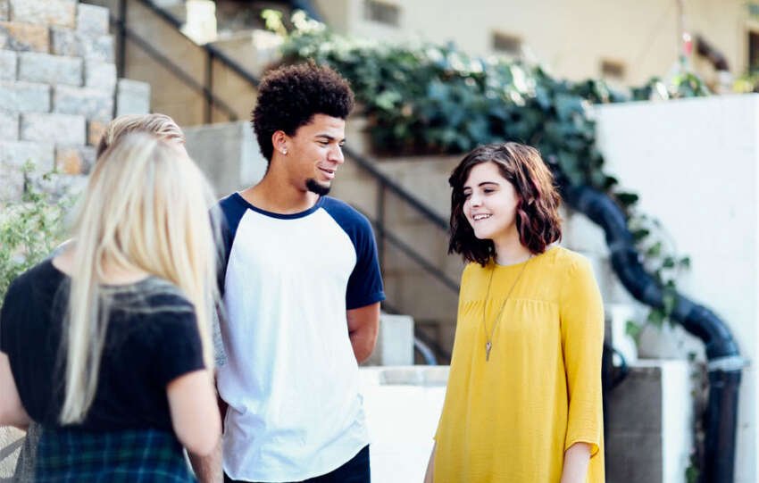 teen friends talking eachother
